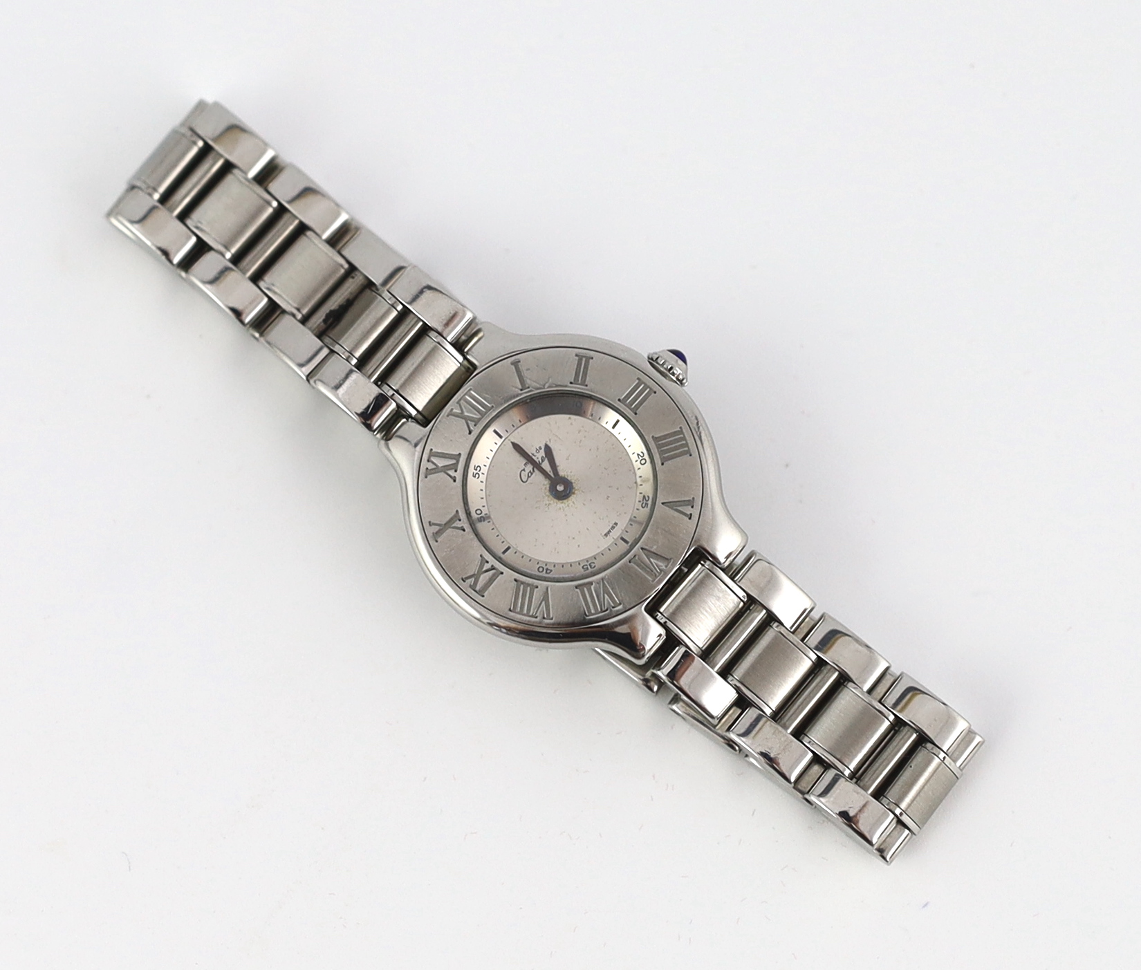 A lady's modern stainless steel Must de Cartier 21 quartz wrist watch, on a stainless steel Cartier bracelet